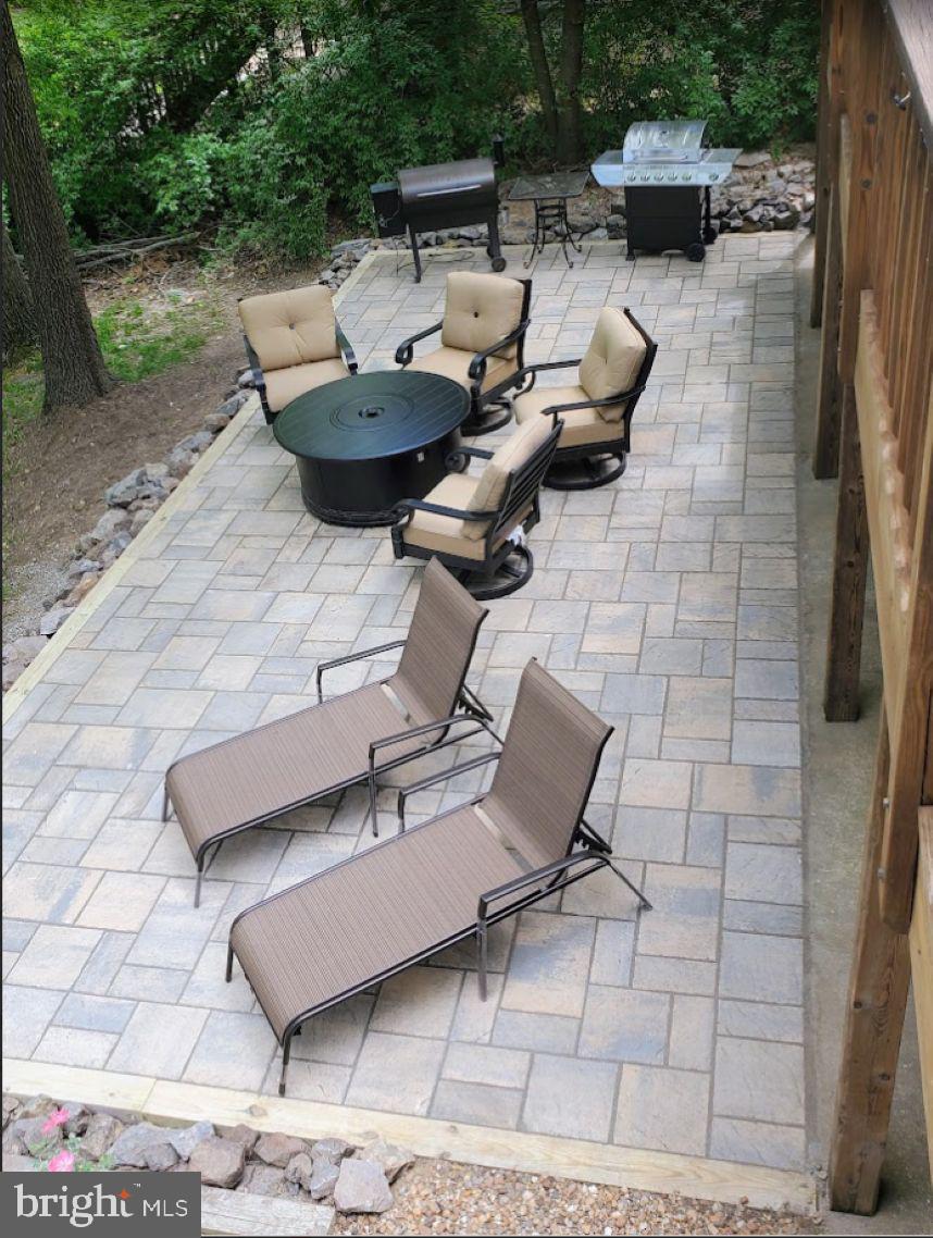 100 Pleasant Grove Road Locust Grove, VA 22508 - Photo 8 of 32 a view of a patio with couple of chairs