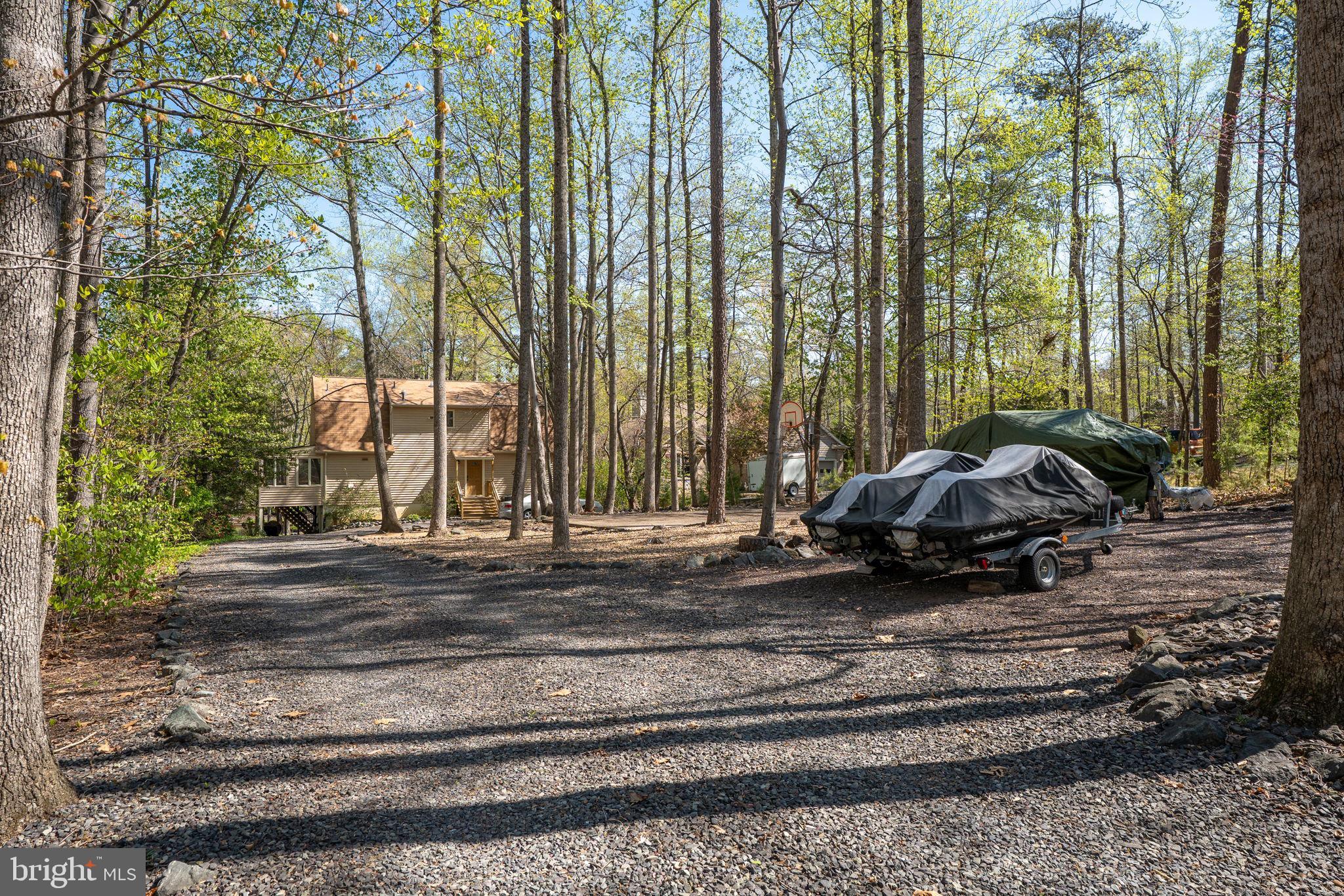 100 Pleasant Grove Road Locust Grove, VA 22508 - Photo 9 of 32 a view of a yard with car parked