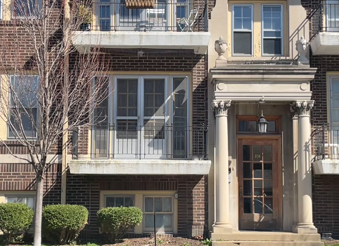 408 North Prairie Street, Unit 8 Champaign, IL 61820 - Photo 1 of 19 a front view of a house with a yard