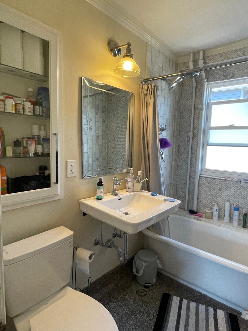 408 North Prairie Street, Unit 8 Champaign, IL 61820 - Photo 16 of 19 a bathroom with a sink and a mirror