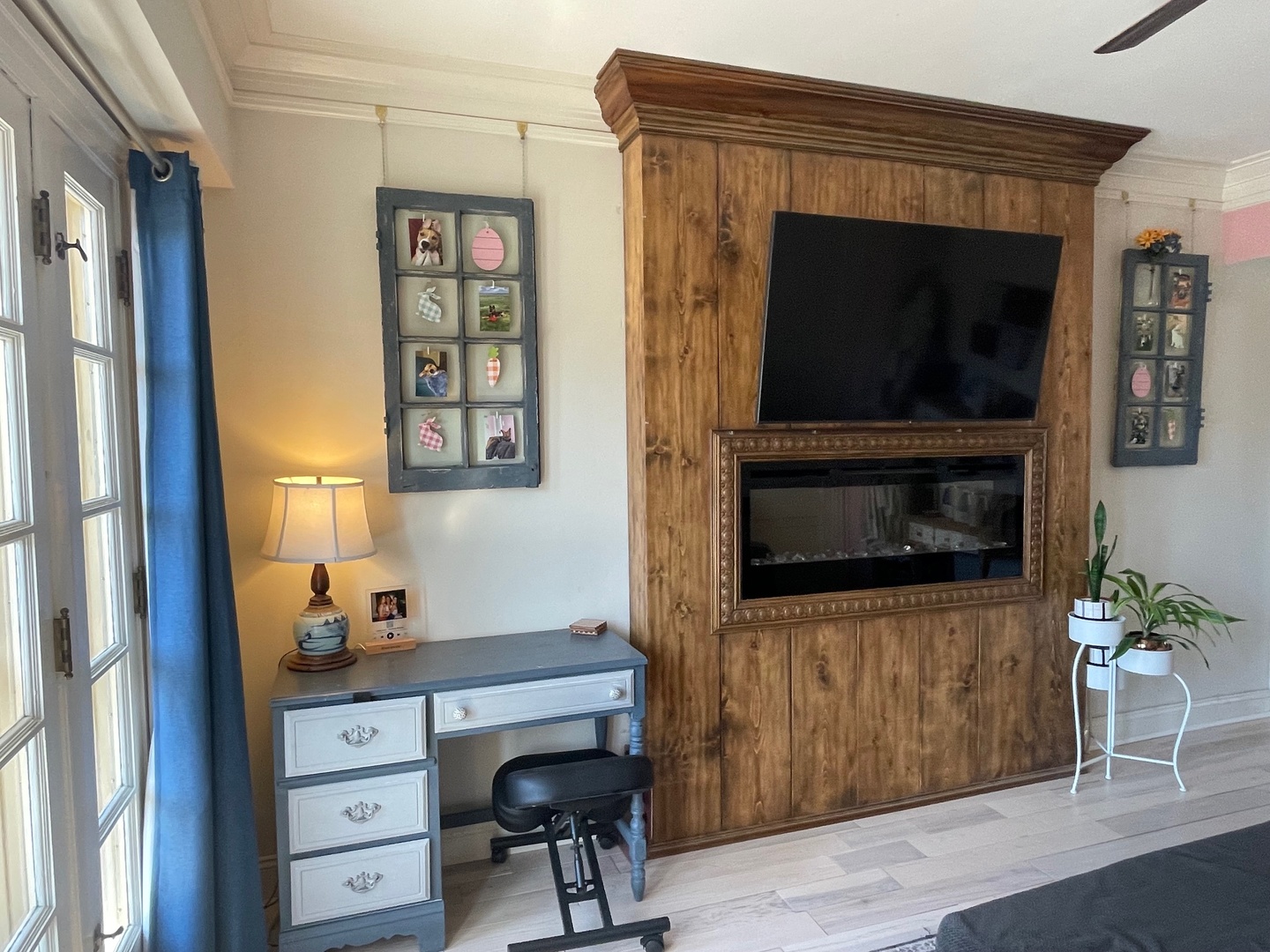 408 North Prairie Street, Unit 8 Champaign, IL 61820 - Photo 5 of 19 a living room with a fireplace and a flat screen tv