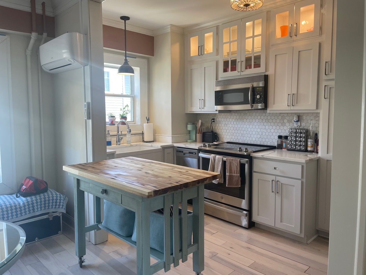 408 North Prairie Street, Unit 8 Champaign, IL 61820 - Photo 7 of 19 a kitchen with stainless steel appliances granite countertop a stove top oven a sink and a refrigerator