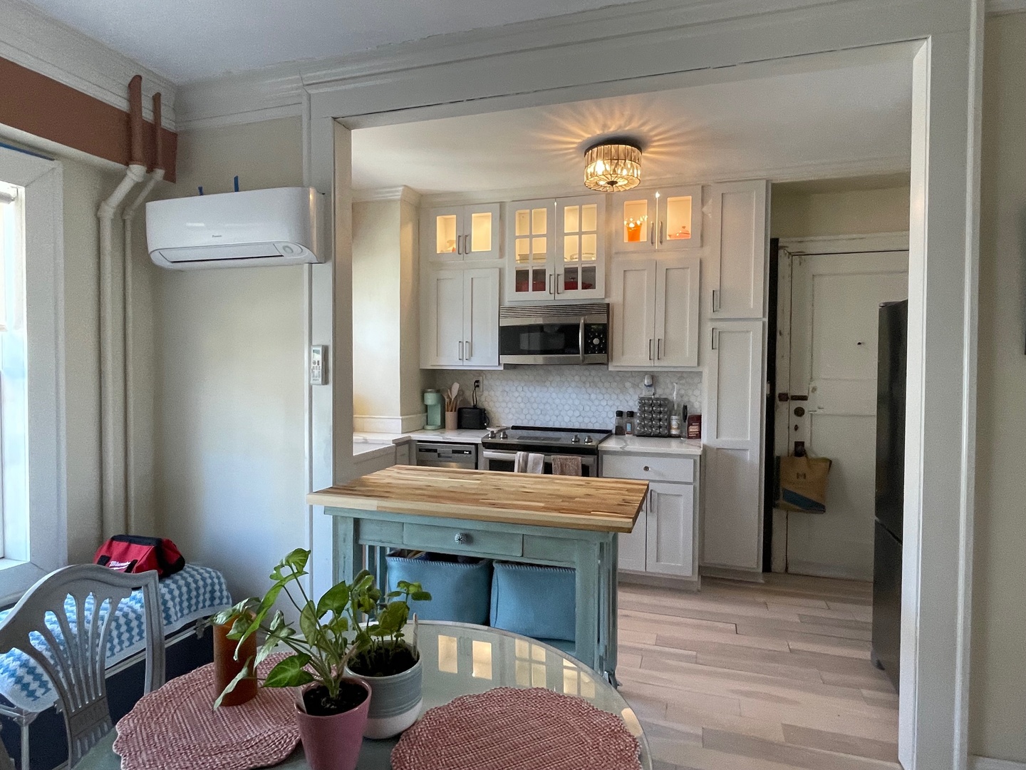 408 North Prairie Street, Unit 8 Champaign, IL 61820 - Photo 8 of 19 a kitchen with stainless steel appliances kitchen island granite countertop a refrigerator a stove a sink and a microwave