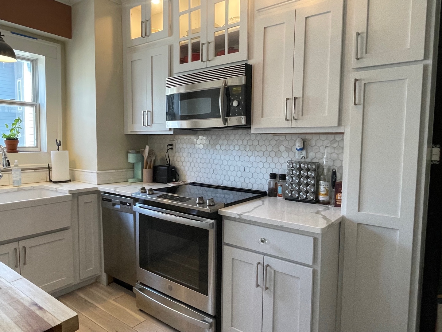 408 North Prairie Street, Unit 8 Champaign, IL 61820 - Photo 9 of 19 a kitchen with stainless steel appliances granite countertop white cabinets and a stove