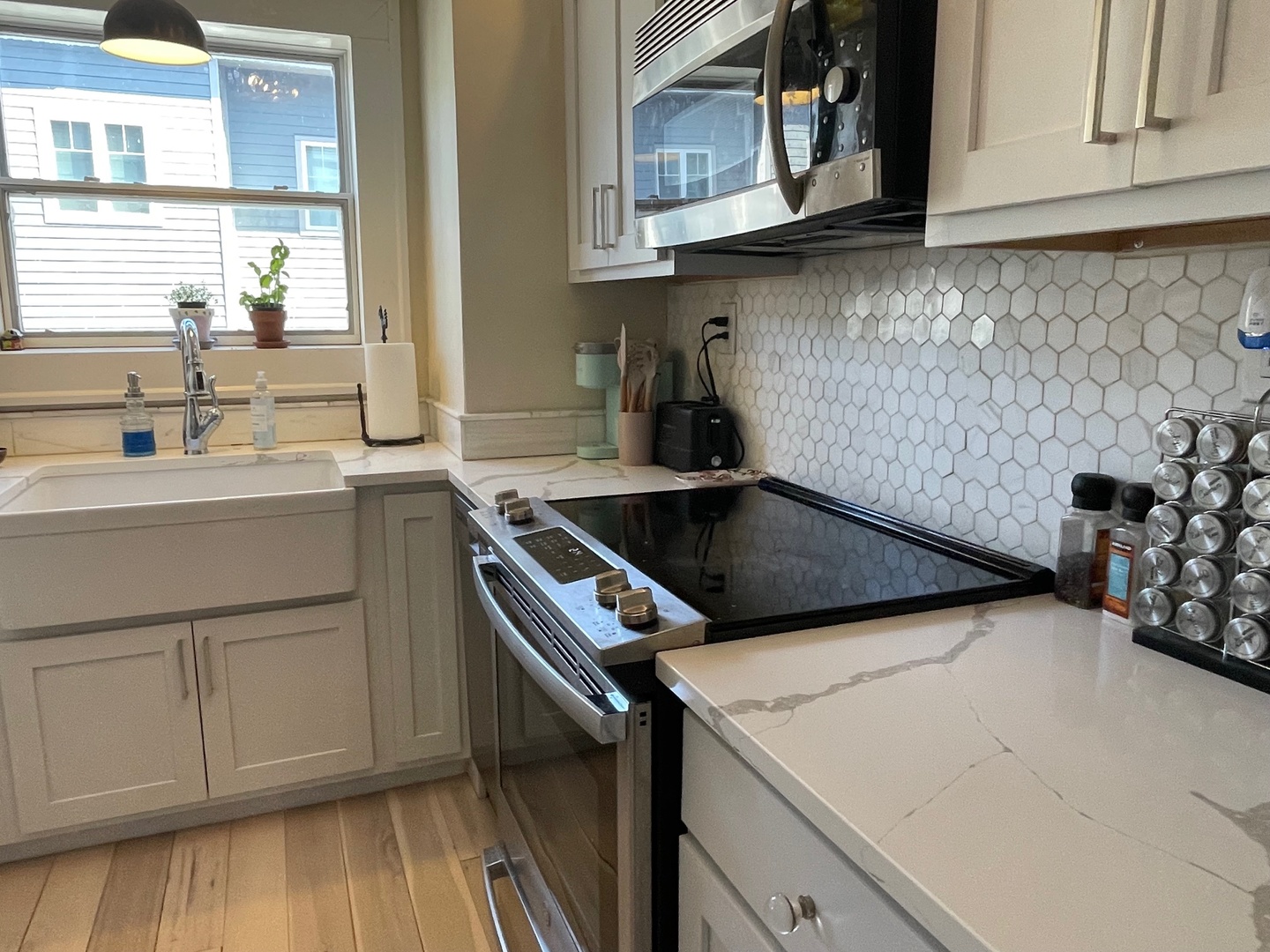408 North Prairie Street, Unit 8 Champaign, IL 61820 - Photo 10 of 19 a kitchen that has a sink and a stove