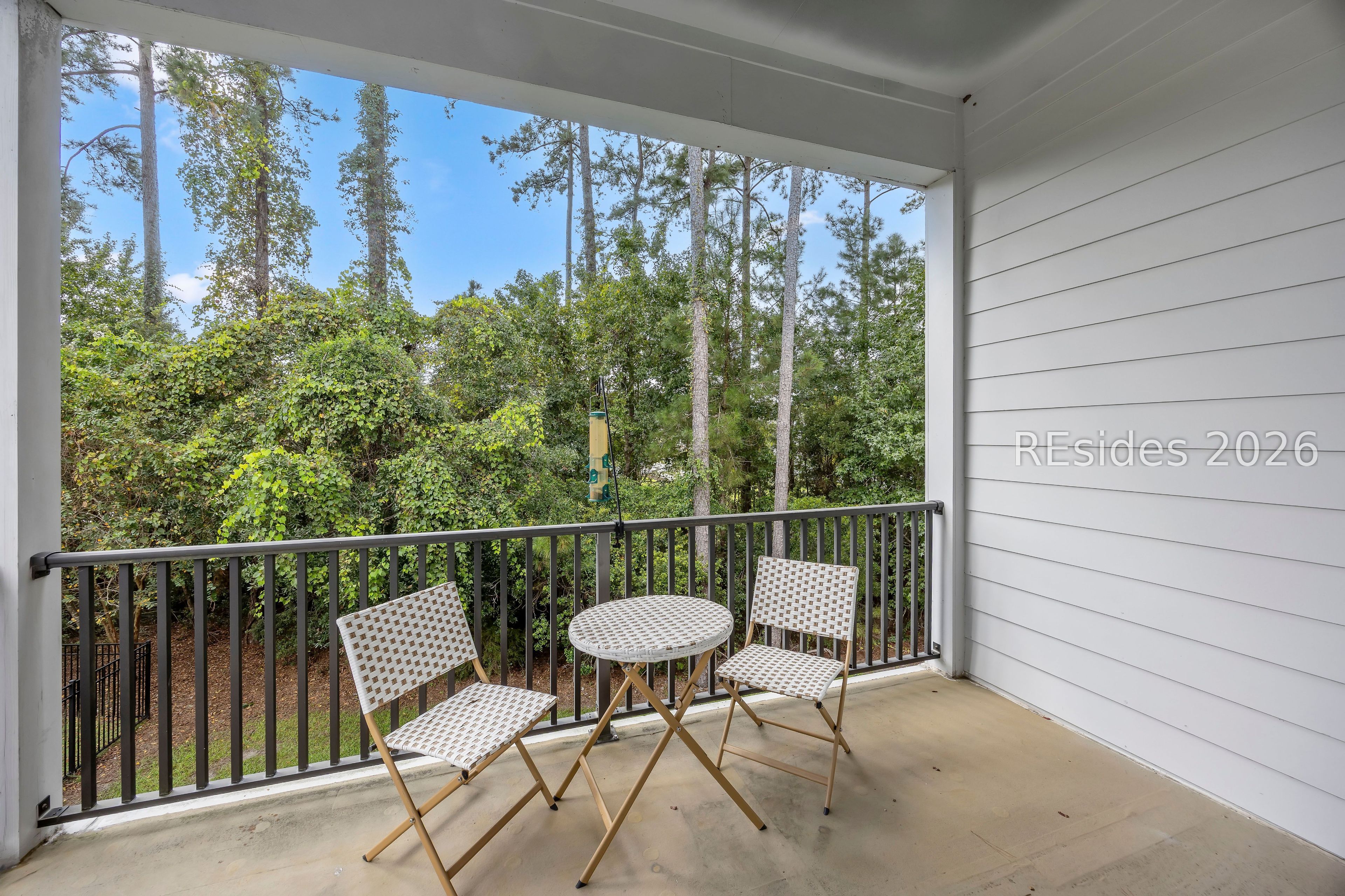 23 Augustine Road Bluffton, SC 29910 - Photo 40 of 53 Balcony overlooing back yard with wooded views