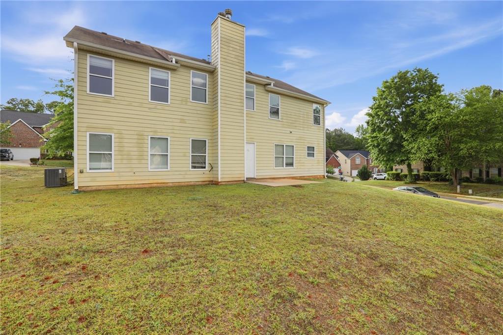 4968 Locherby Drive Fairburn, GA 30213 - Photo 37 of 39 a front view of a house with a yard