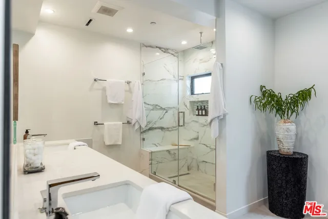 a bathroom with a sink and mirror