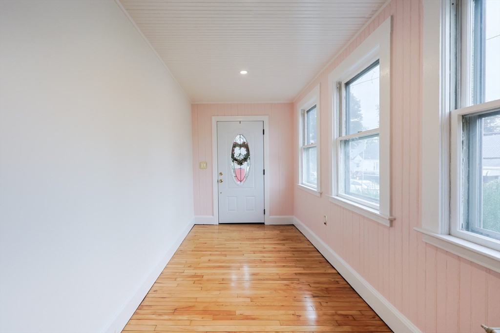 12 Lothrop Street Saugus, MA 01906 - Photo 17 of 42 a view of a hallway with wooden floor and windows