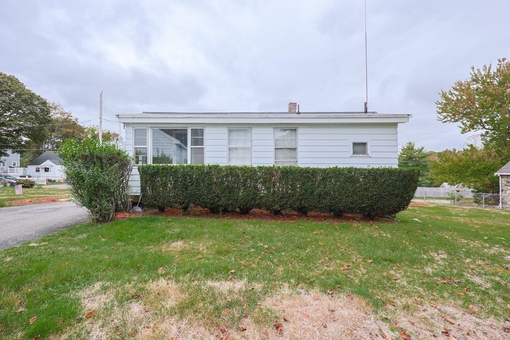 12 Lothrop Street Saugus, MA 01906 - Photo 26 of 42 a view of a house with a yard and plants
