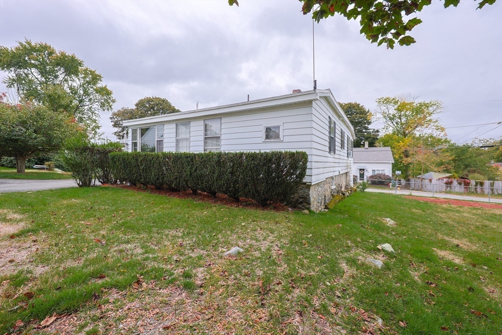 12 Lothrop Street Saugus, MA 01906 - Photo 27 of 42 a view of a house with a back yard