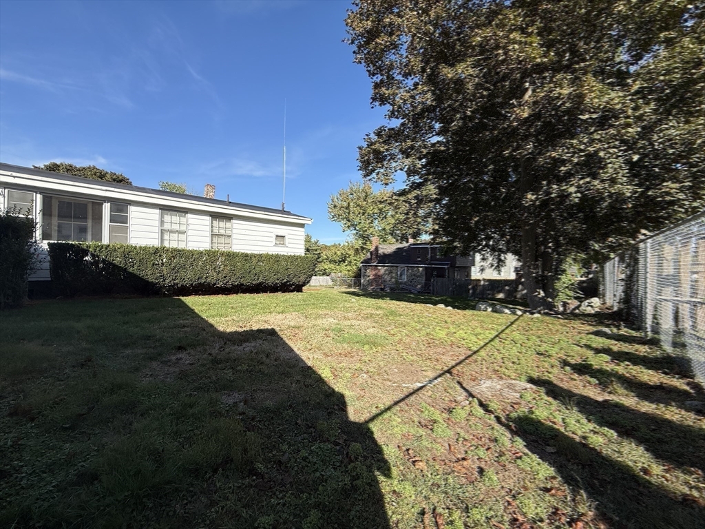 12 Lothrop Street Saugus, MA 01906 - Photo 32 of 42 a front view of a house with a yard and trees