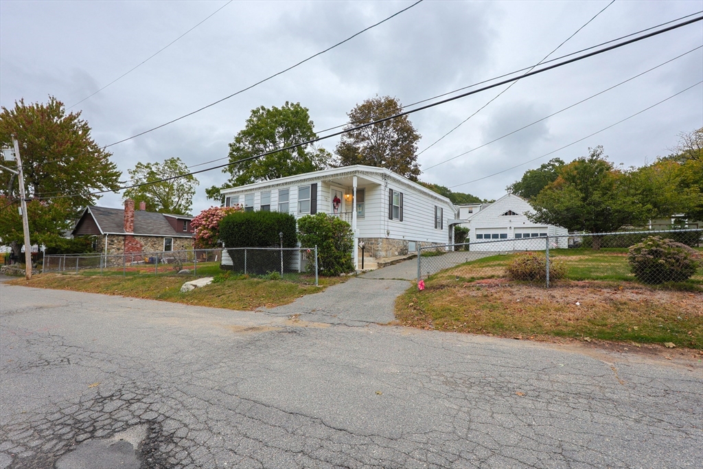 12 Lothrop Street Saugus, MA 01906 - Photo 42 of 42 a view of a house with pool and a yard