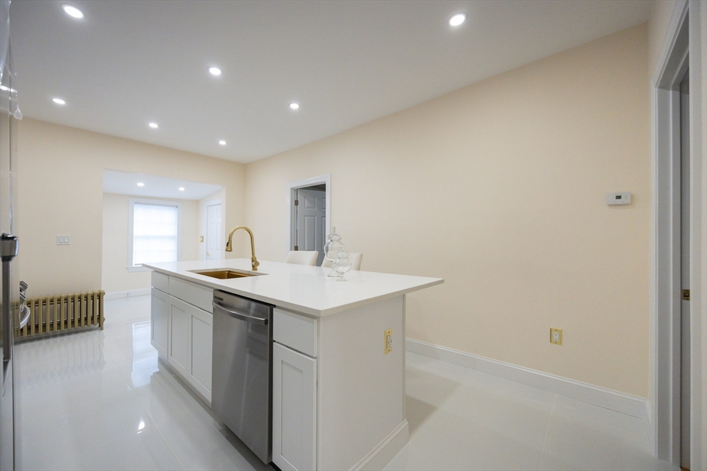 12 Lothrop Street Saugus, MA 01906 - Photo 7 of 42 a kitchen with sink and mirror