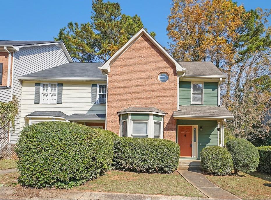1115 Country Club Place Kennesaw, GA 30144 - Photo 1 of 1 front view of a house with a garden