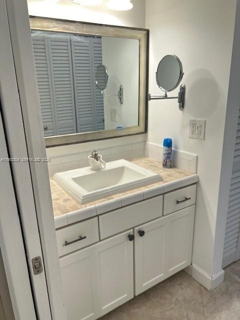 13720 Southwest 90th Avenue, Unit 8 Miami, FL 33176 - Photo 10 of 13 a bathroom with a sink and a mirror