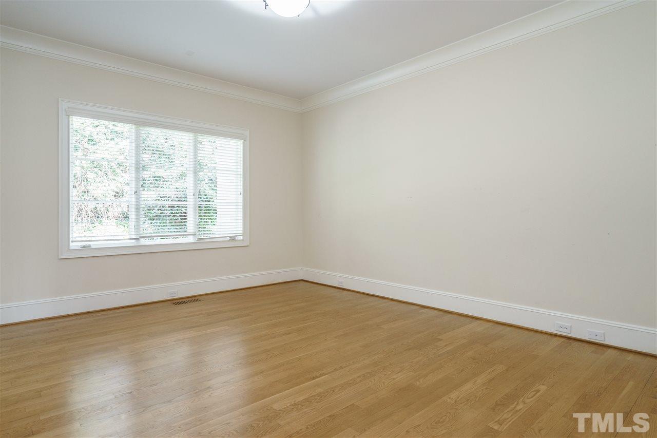 2114 Buckingham Road Raleigh, NC 27607 - Photo 17 of 25 an empty room with a window