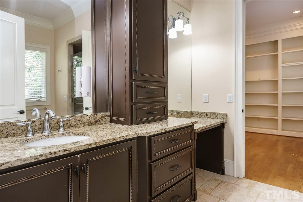2114 Buckingham Road Raleigh, NC 27607 - Photo 18 of 25 a bathroom with a granite countertop sink and a mirror