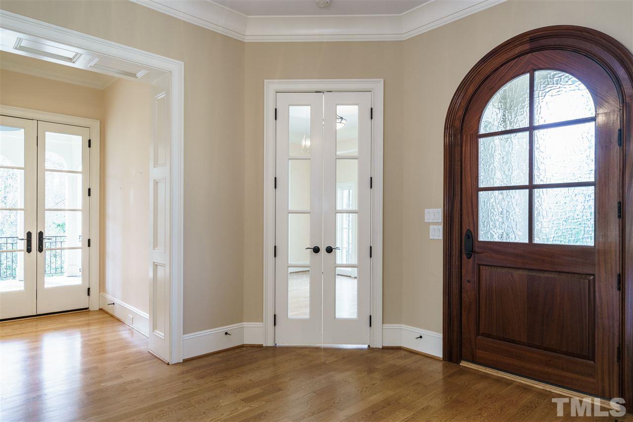 2114 Buckingham Road Raleigh, NC 27607 - Photo 3 of 25 an empty room with wooden floor closet and windows