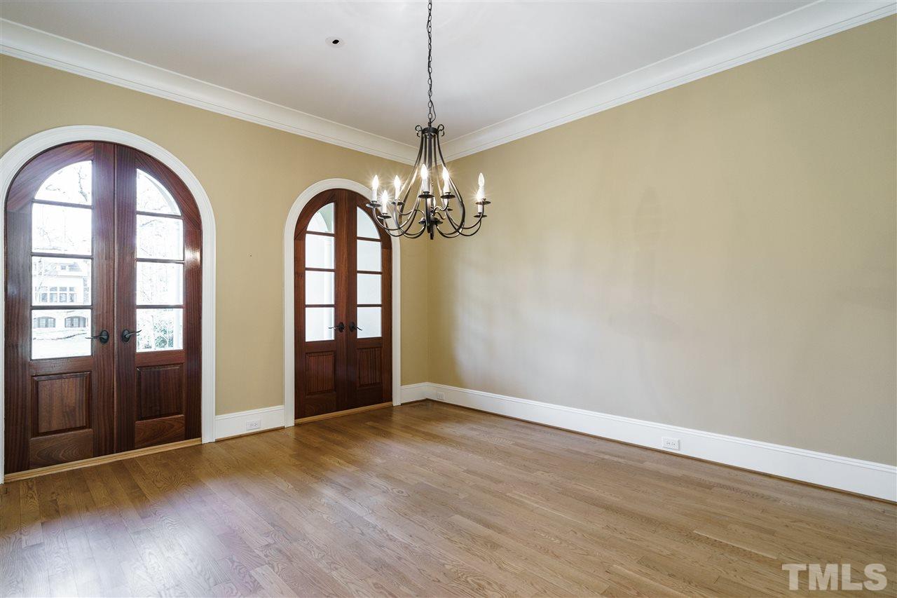 2114 Buckingham Road Raleigh, NC 27607 - Photo 5 of 25 a view of a room with wooden floor and windows