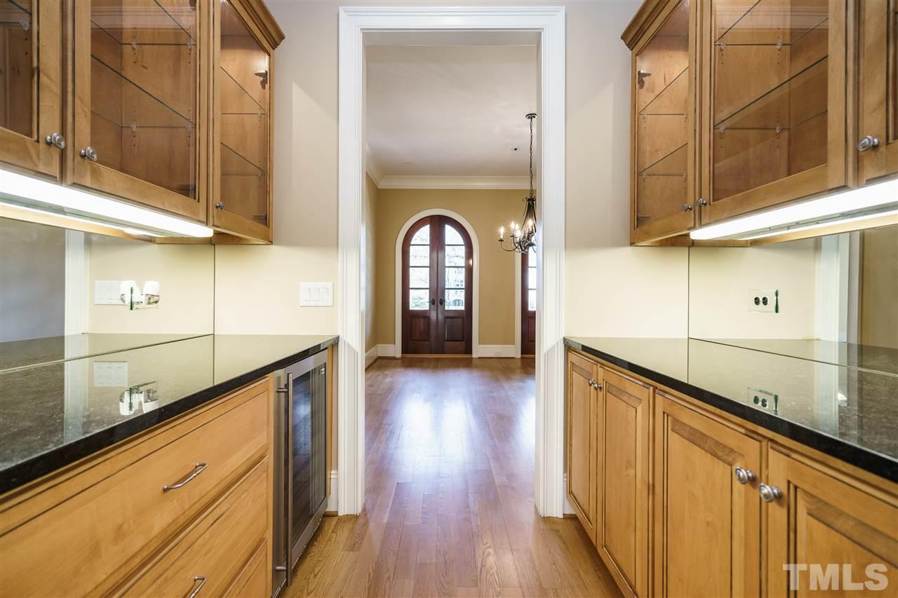2114 Buckingham Road Raleigh, NC 27607 - Photo 6 of 25 a view of a kitchen with wooden floor and cabinets