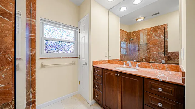 a bathroom with a sink and a mirror