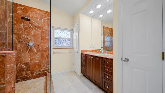 a bathroom with a shower and a toilet