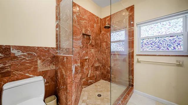 a view of a room with a ceiling fan