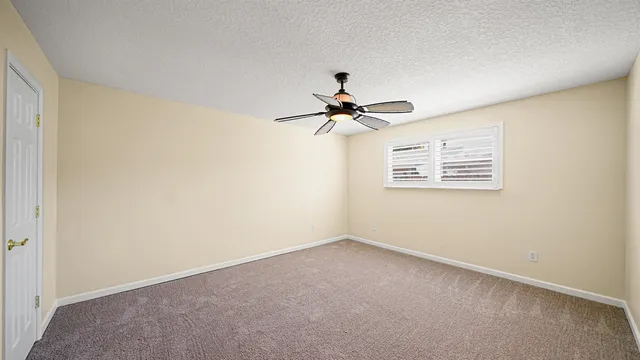 a view of room with a ceiling fan