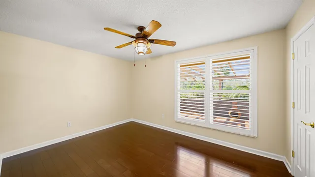 a bathroom with a sink a toilet a mirror a vanity and bathtub