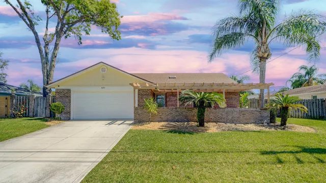 a view of yard with patio