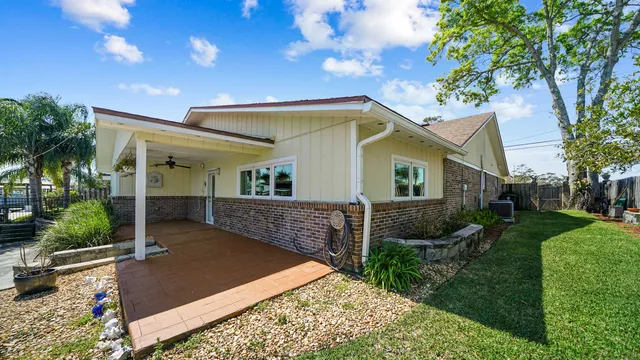 a view of a chairs and table in the patio