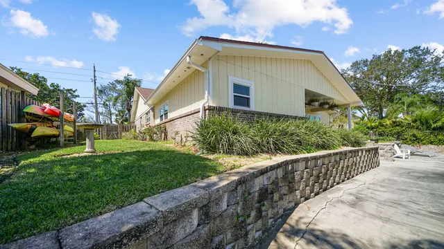 a view of a lake with a house in the background