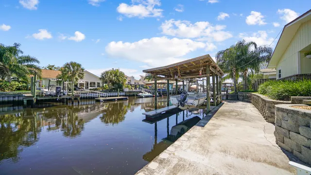 an aerial view of residential houses with outdoor space and swimming pool