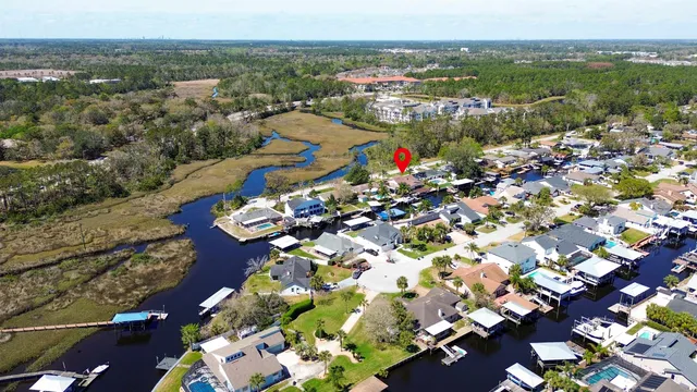 an aerial view of a houses with yard