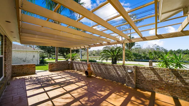 a view of a house with swimming pool and sitting area