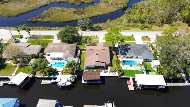 an aerial view of residential houses with outdoor space