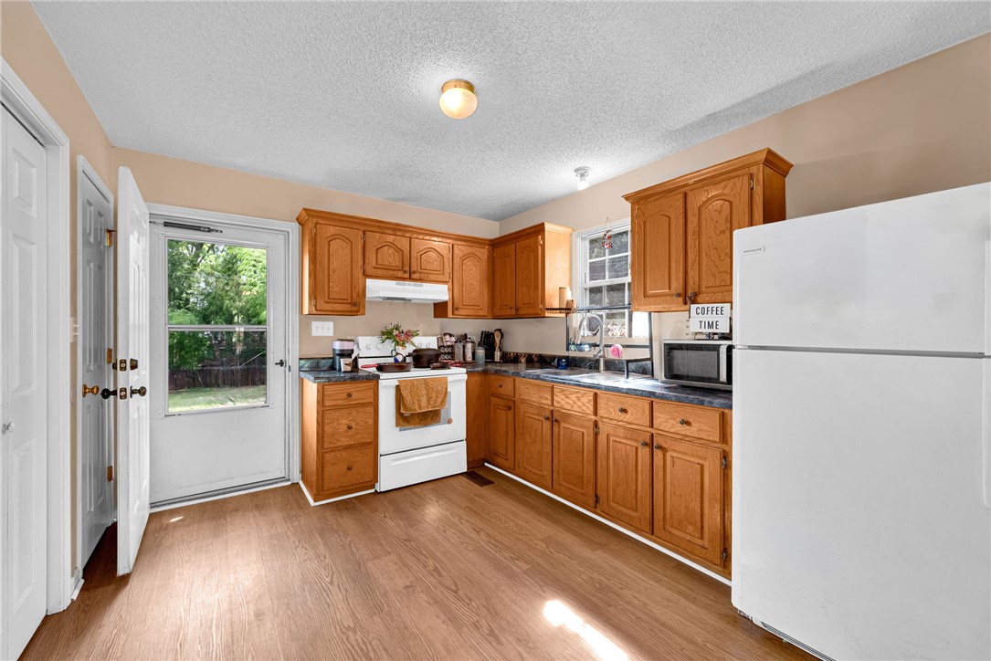 1020 Elizabeth Street Anderson, SC 29624 - Photo 9 of 22 A functional kitchen provides ample wood cabinetry and counter space, with convenient outdoor access.