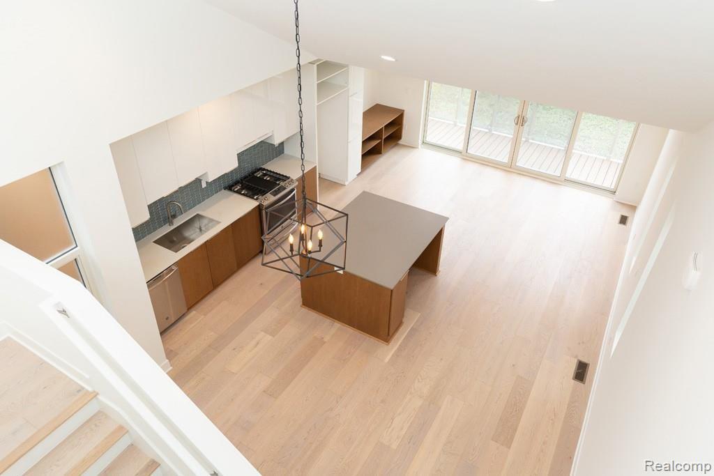 2858 John R Street Detroit, MI 48201 - Photo 8 of 12 Overview of Kitchen/Living SpaceLarge Private Balcony off Living with HUGE door-walls out