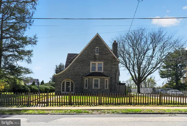 a front view of a house with a fence