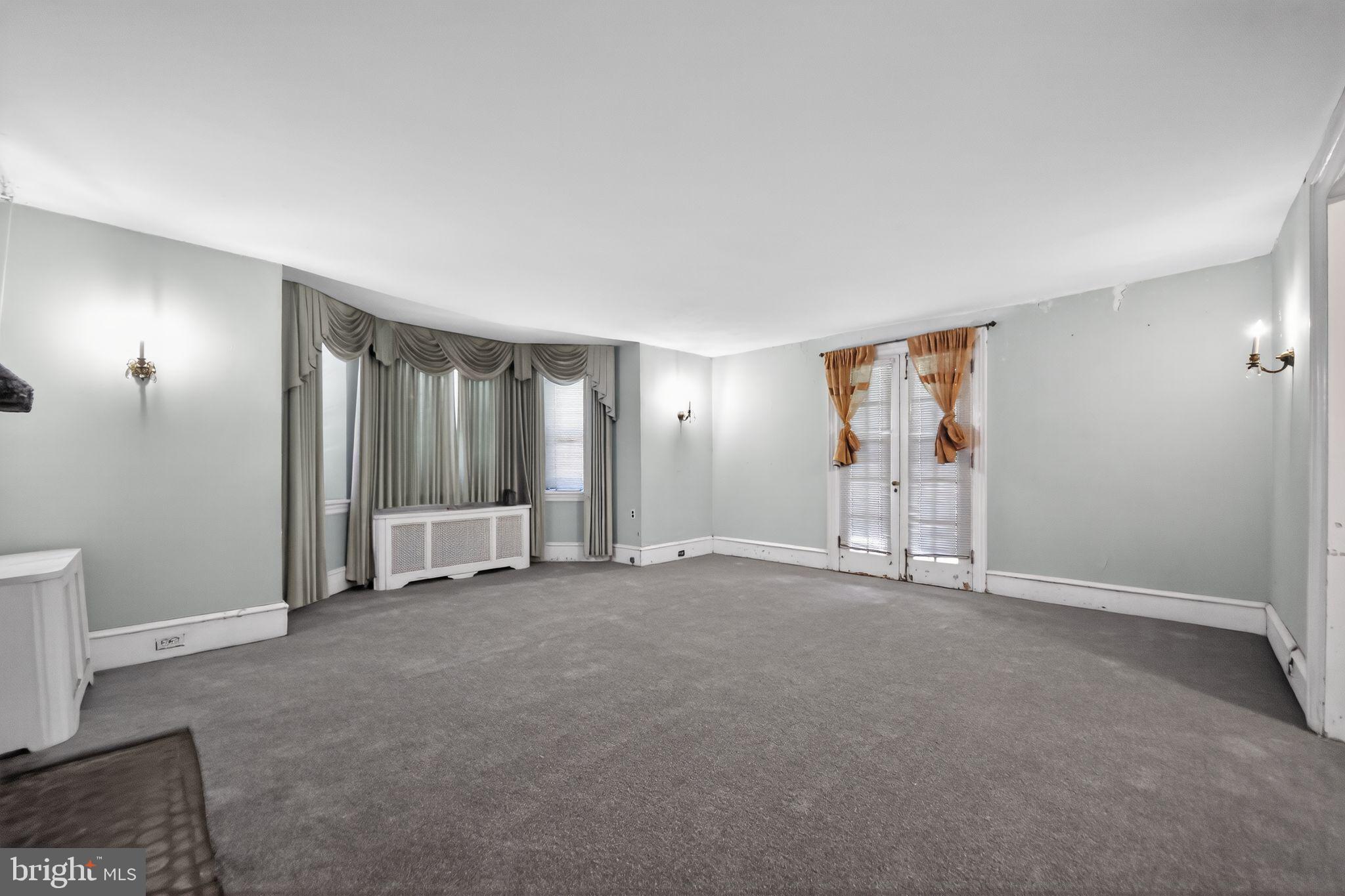 6448 Cherokee Street Philadelphia, PA 19119 - Photo 12 of 33 an empty room with windows and closet