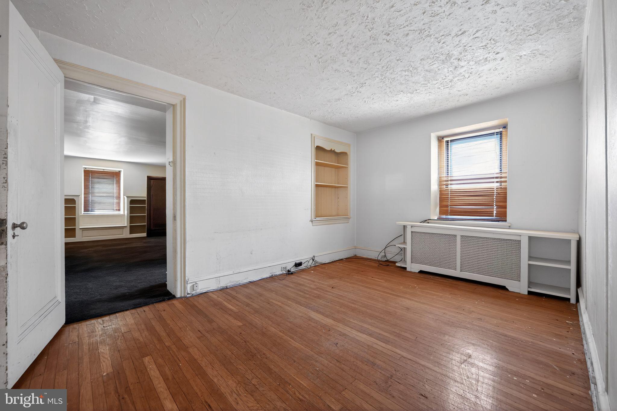 6448 Cherokee Street Philadelphia, PA 19119 - Photo 18 of 33 a bedroom with a bed and a window