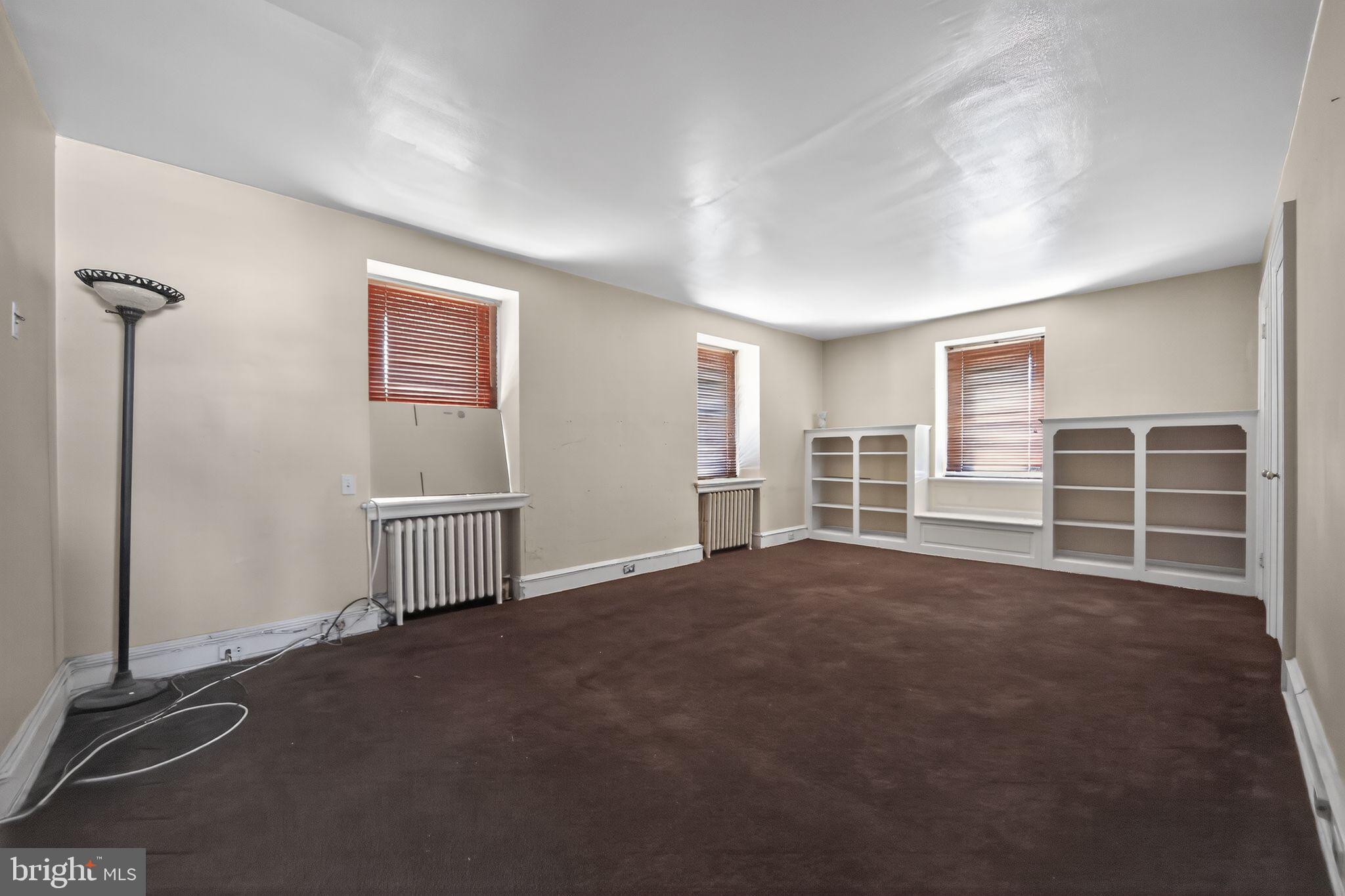 6448 Cherokee Street Philadelphia, PA 19119 - Photo 19 of 33 a view of a livingroom with an empty space and a window