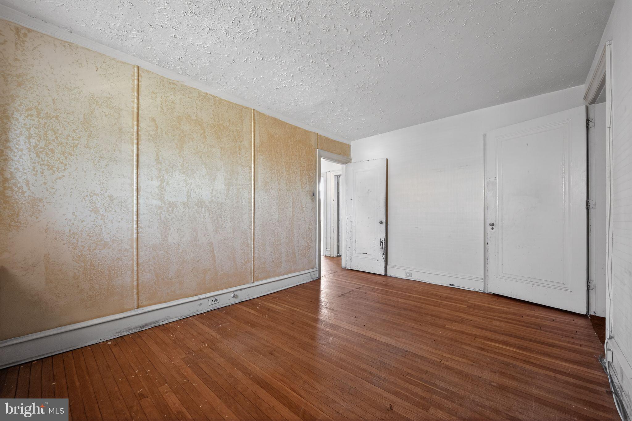 6448 Cherokee Street Philadelphia, PA 19119 - Photo 21 of 33 a view of an empty room with wooden floor