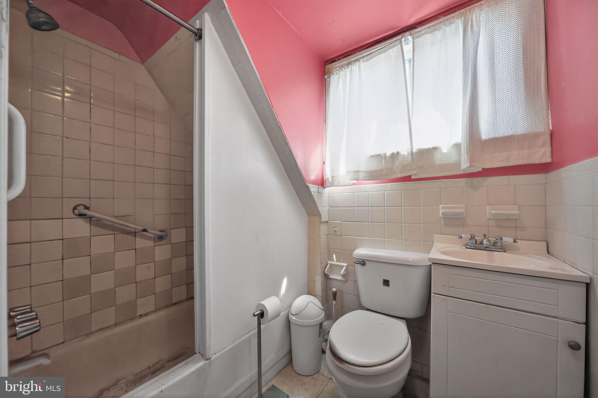 6448 Cherokee Street Philadelphia, PA 19119 - Photo 24 of 33 a bathroom with a toilet a sink and a shower