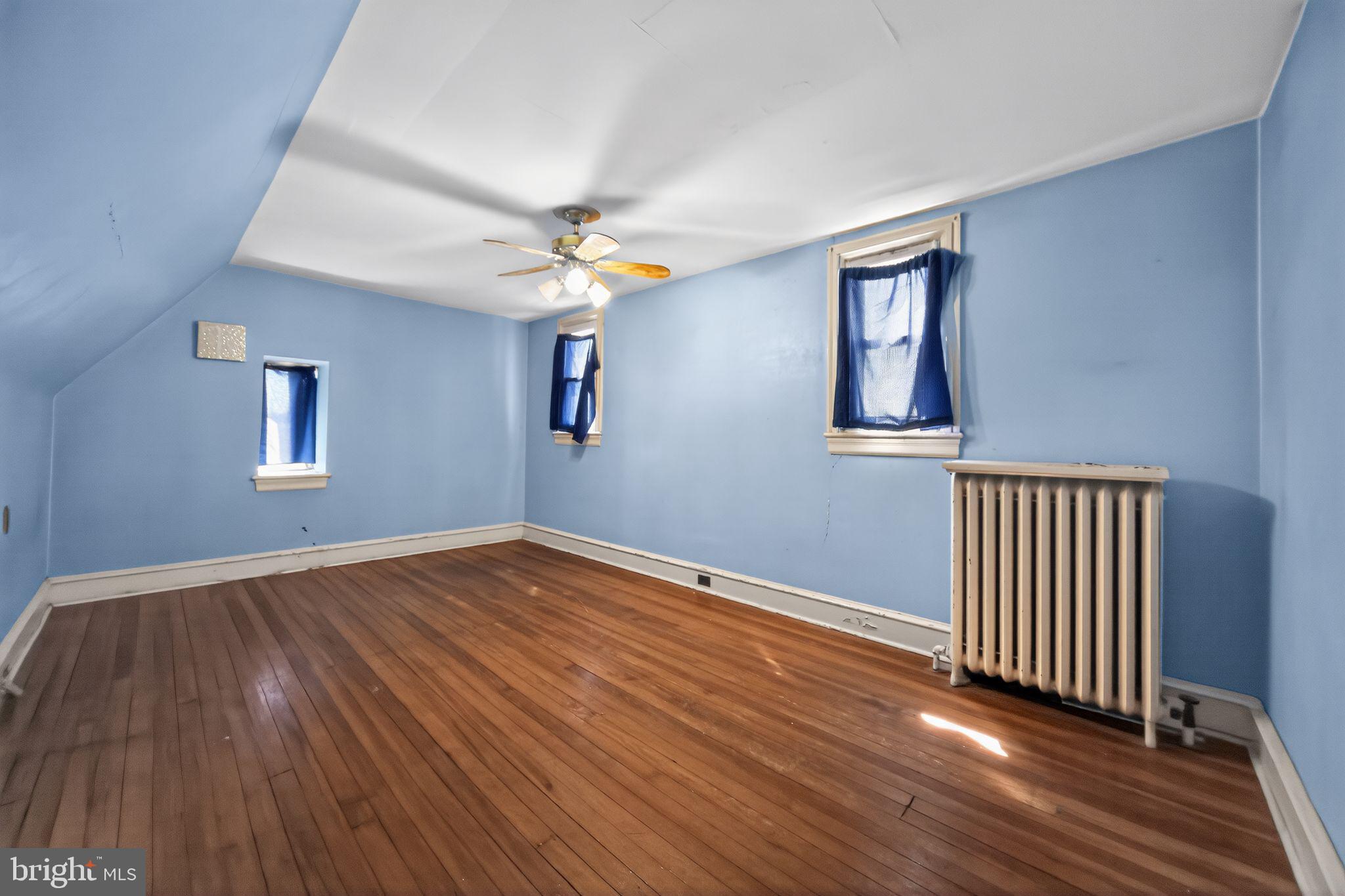 6448 Cherokee Street Philadelphia, PA 19119 - Photo 25 of 33 wooden floor in an empty room with a window