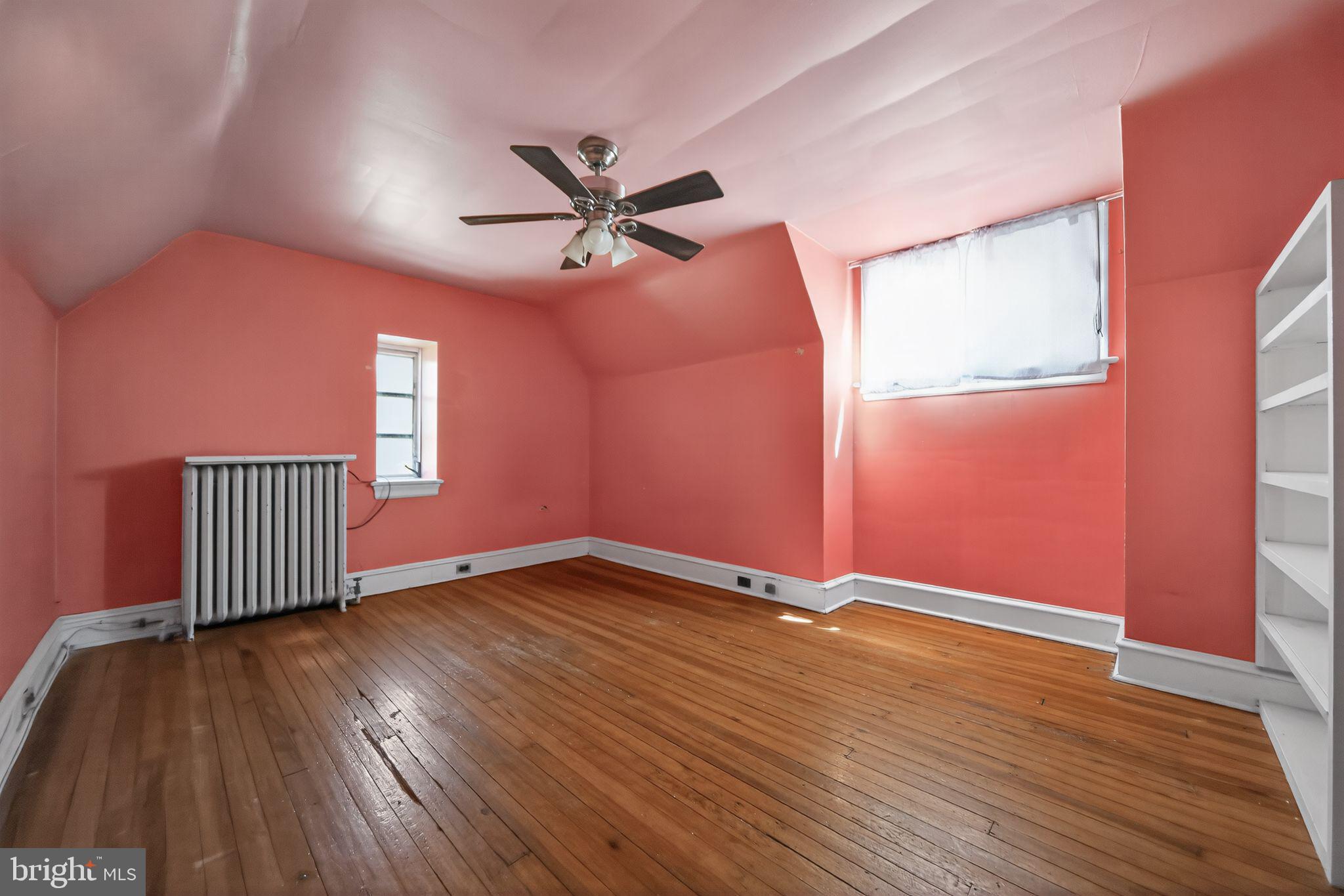 6448 Cherokee Street Philadelphia, PA 19119 - Photo 27 of 33 a view of empty room with wooden floor and fan