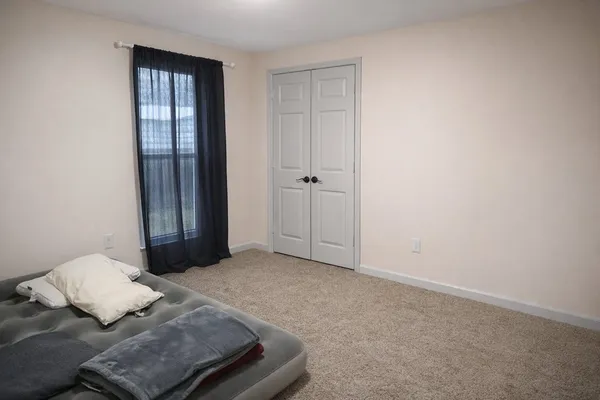 a kitchen with stainless steel appliances granite countertop a refrigerator a stove a sink dishwasher a dining table and chairs with wooden floor