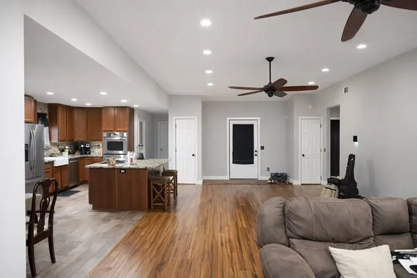 a bathroom with a bathtub sink and mirror