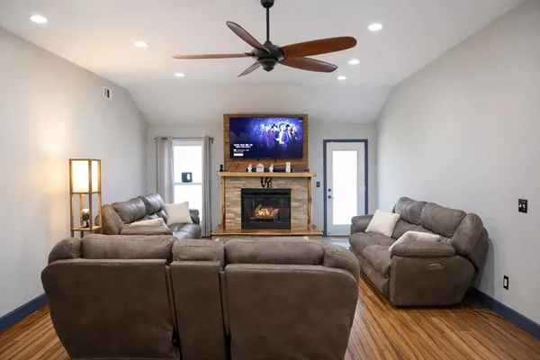 a bathroom with a toilet and a black white door